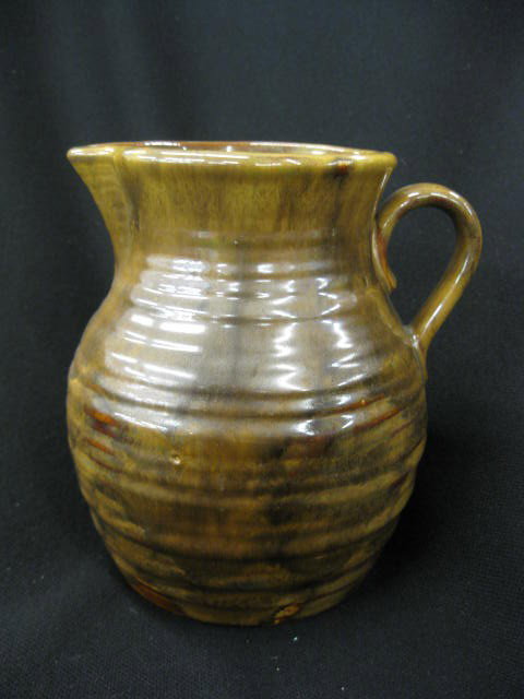 Fulper Pottery Pitcher, ribbed chocolate: slip glaze, Arts & Crafts era, signed, 6", excellent.Fulper Pottery was incorporated in 1899 although the company was well established prior to this date. The first art pottery line introduced by Fulp