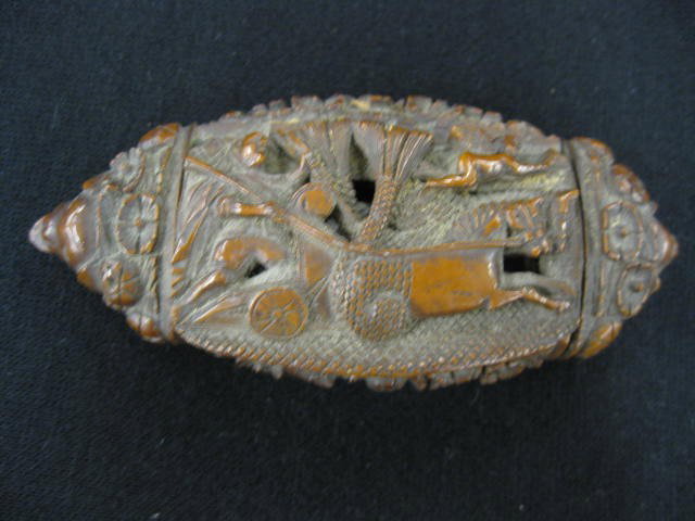 18th Century English Carved Snuff Box,: from a nut, one side with chariot other with royality, 2" x 4", dryness crack, scarce