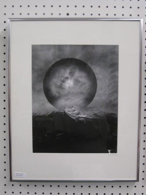 Jerry Norman Uelsmann Photograph,: rowboat in water, cloud sphere, initialed & dated 1982, silver print, image area 14" x 11", see appraisal....Uelsmann was born in Detroit, Michigan. When he was in high school, his interest in photogr