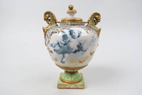 R.st.K Turn Teplitz Porcelain Urn with Cherub,: finely hand painted with raised butterflies and gold work, elaborate handles, pedestal base, late 19th century, 7 1/2", by RIESSNER, STELLMACHER & KESSEL, excellent.