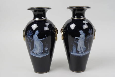 Pair of Rorstrand Pate Sur Pate Vases,: fine cameo porcelain on porcelain scenes of classical man and woman, he is holding a snake, both near a fire, mirror black glaze with gold trim, circa 1900, 10" tall,