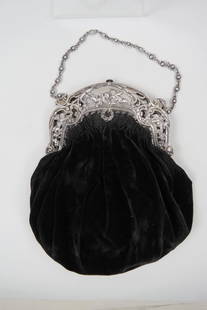 Continental Silver Purse with Cherub Decor,: elaborate floral openwork, hinged clasp, black velvet body, 9" X 9" plus silver chain, circa 1900,.800 fine silver, 321 grams in total.