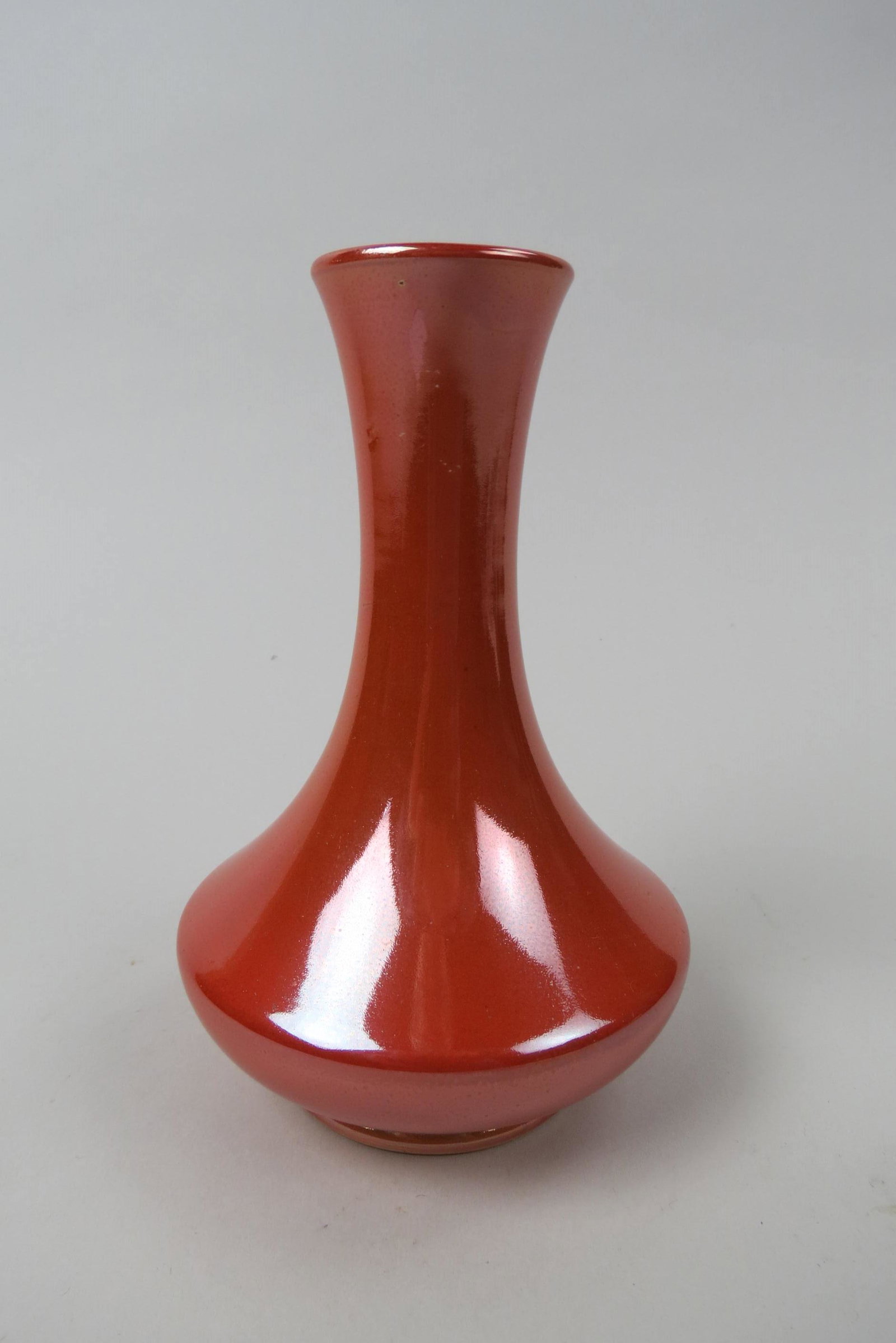 Moorcroft Pottery Vase,: orange luster glaze, 6", excellent...............Founder William Moorcroft first began work as a pottery designer in the late 19th century when he joined James MacIntyre & Company. Moorcroft was an in