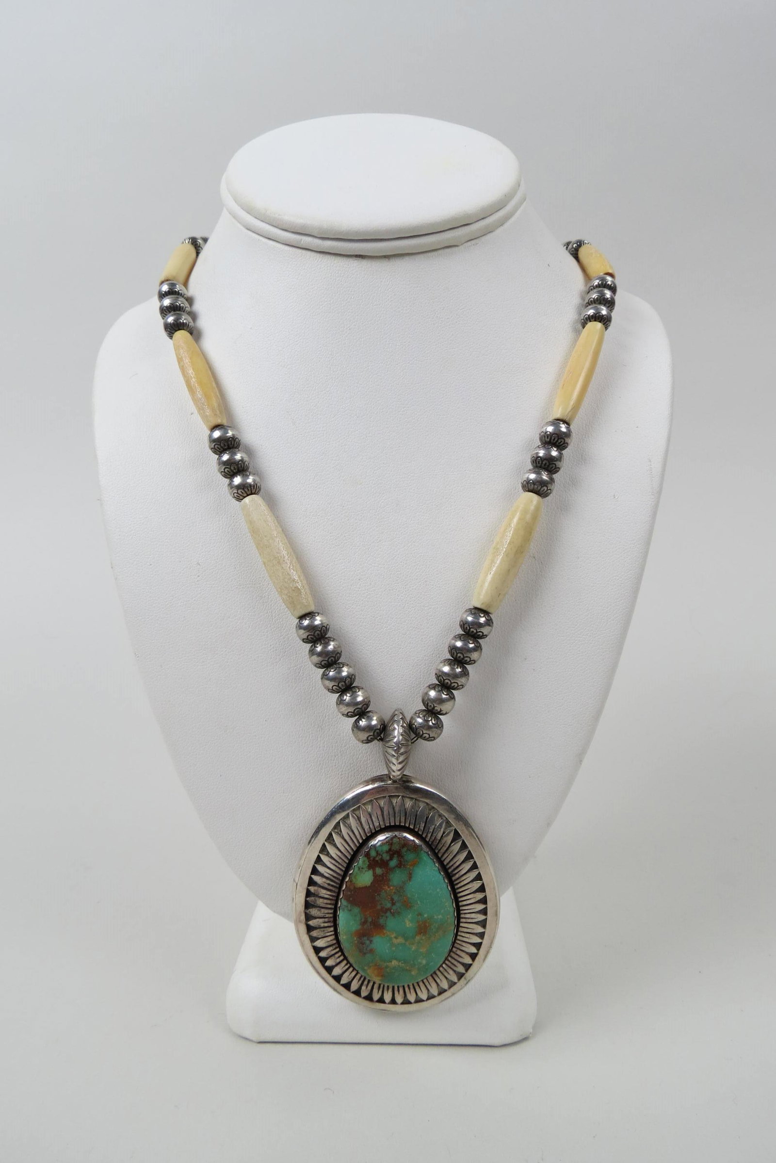 Navajo Turquoise & Sterling Necklace, signed,: Derrick Gordon, beautiful ovoid stone in pendant, decorated beads and bone cylinders on necklace, 110 grams, 26" long, pendant is 3" X 2".