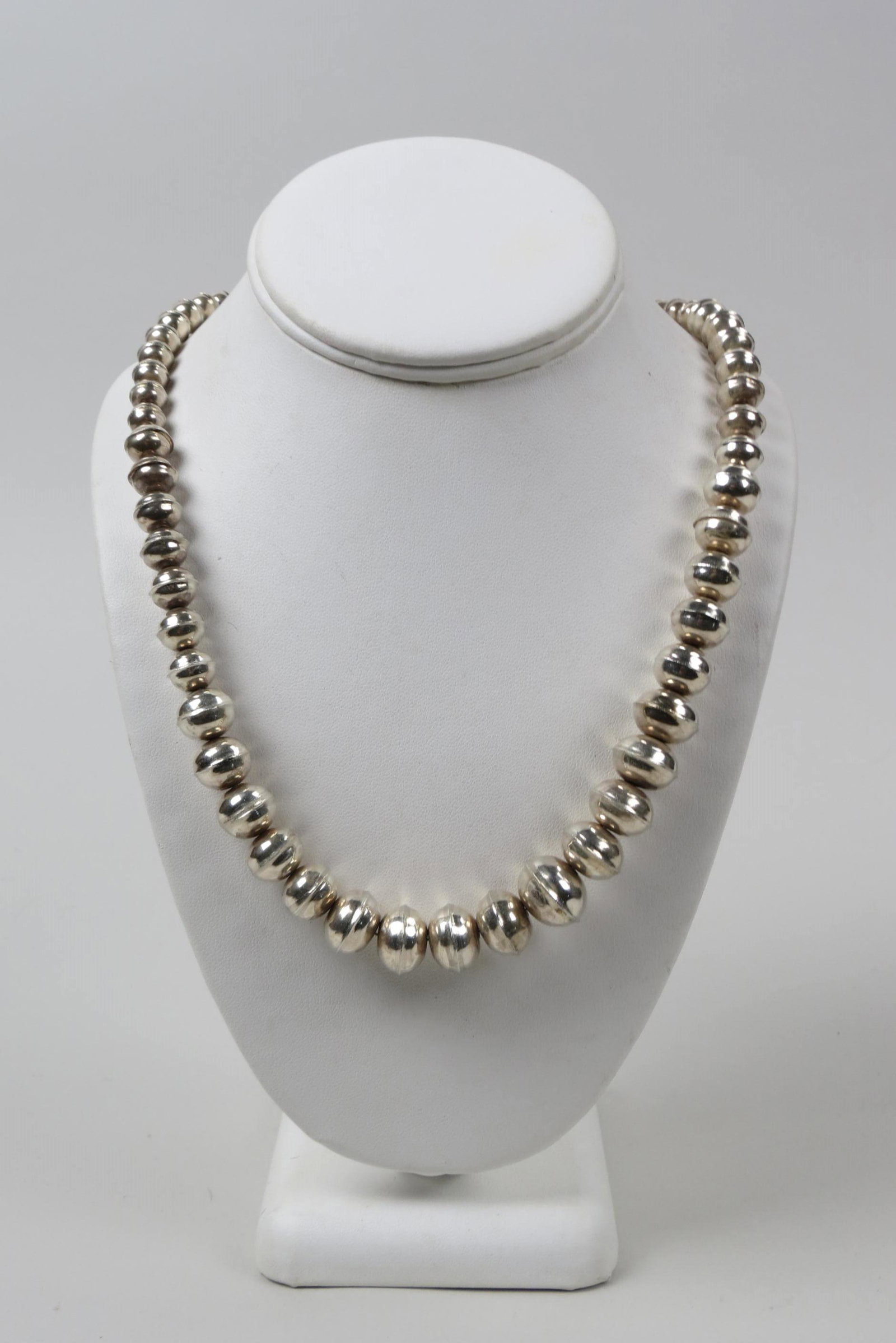 Navajo Sterling Bead Necklace, "Navajo Pearls",: graduated ribbed concave shape beads, 45 grams, 26" long.