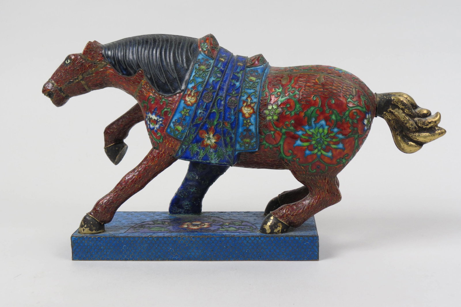 Chinese Cloisonne Figurine of a Horse, signed,: in parade dress, platform base, 6 1/2" tall, 12" long.