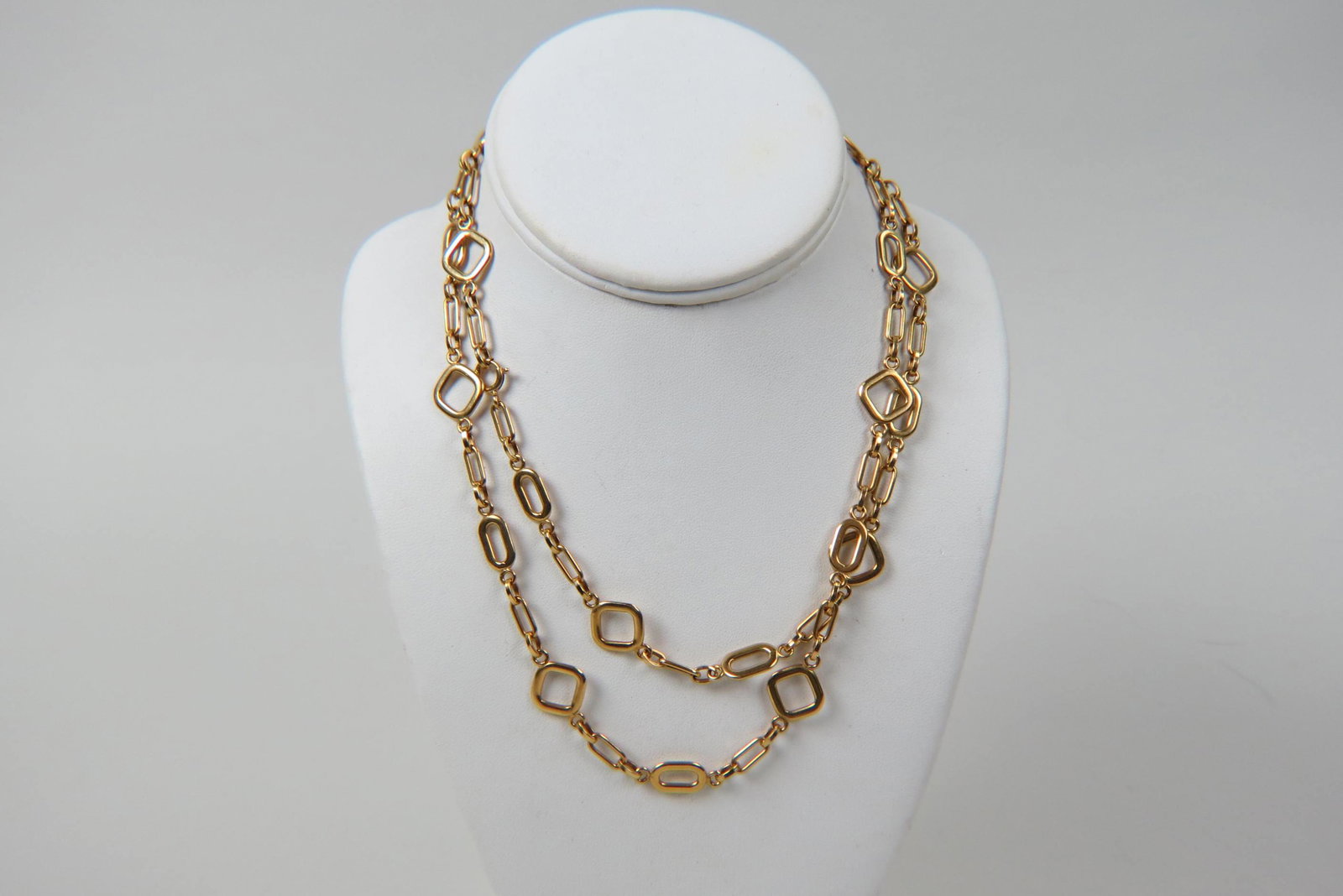 18K Gold Designer Necklace,: various style links, 36" long, 55 grams.