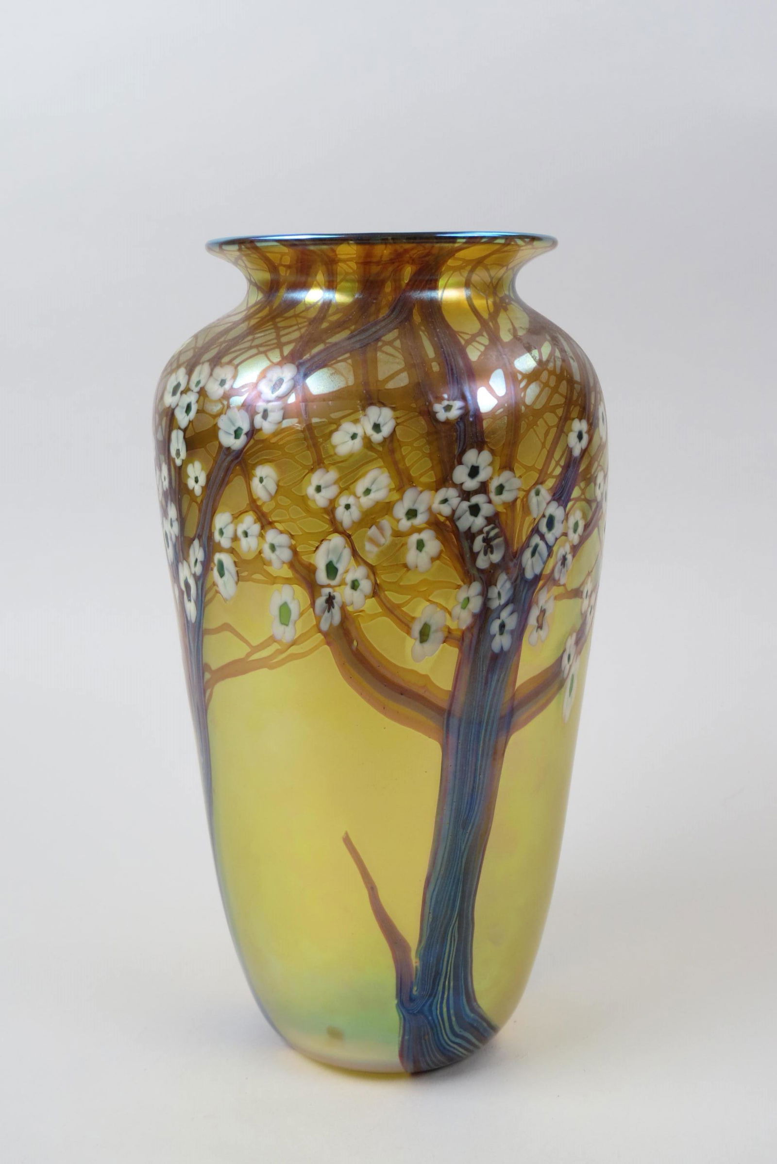 Orient & Flume Art Glass Vase,: white flowering vine on golden iridescent, 12 3/4" tall, signed, excellent......Orient & Flume produces fine art glass for the collector. These signed pieces capture nature's inspiration in both iride