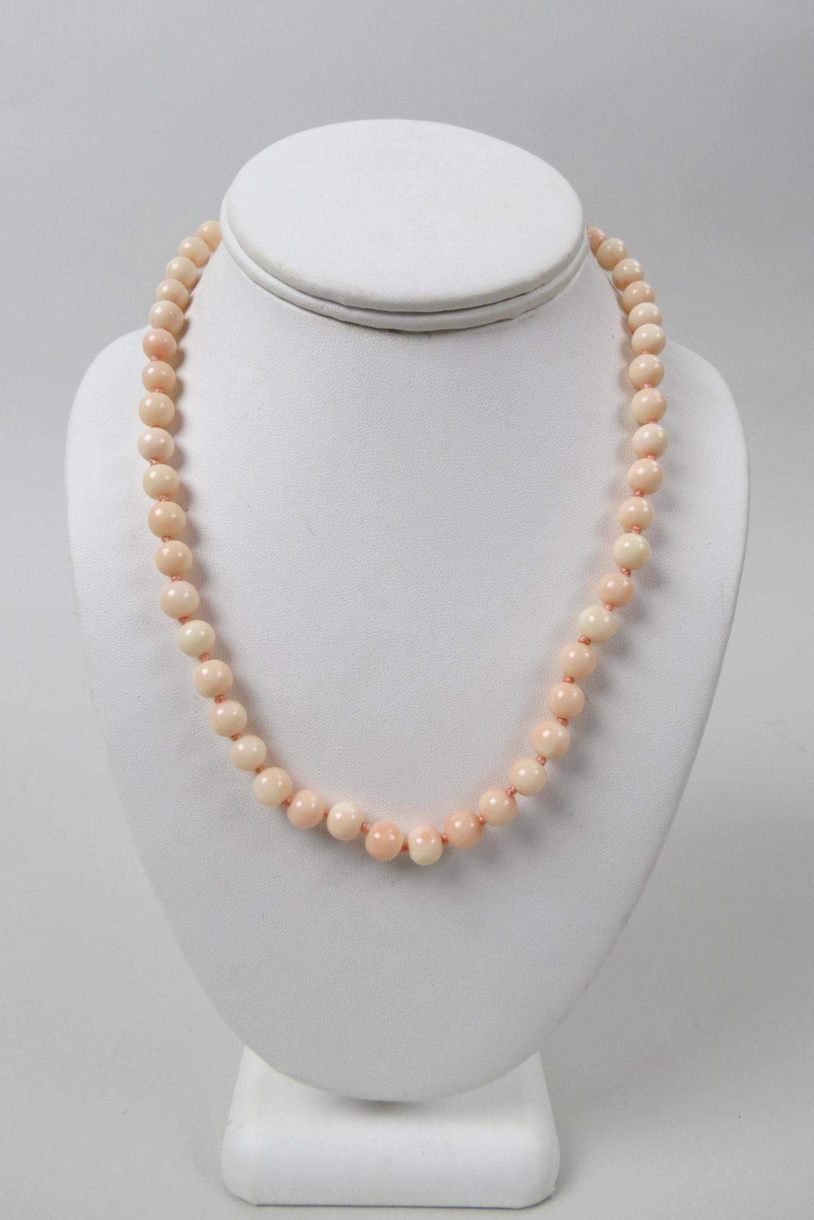 Coral Bead Necklace,: 54 angel skin coral beads measuring apporx. 66 mm with 14K yellow gold clasp, 18" long, 33 grams.