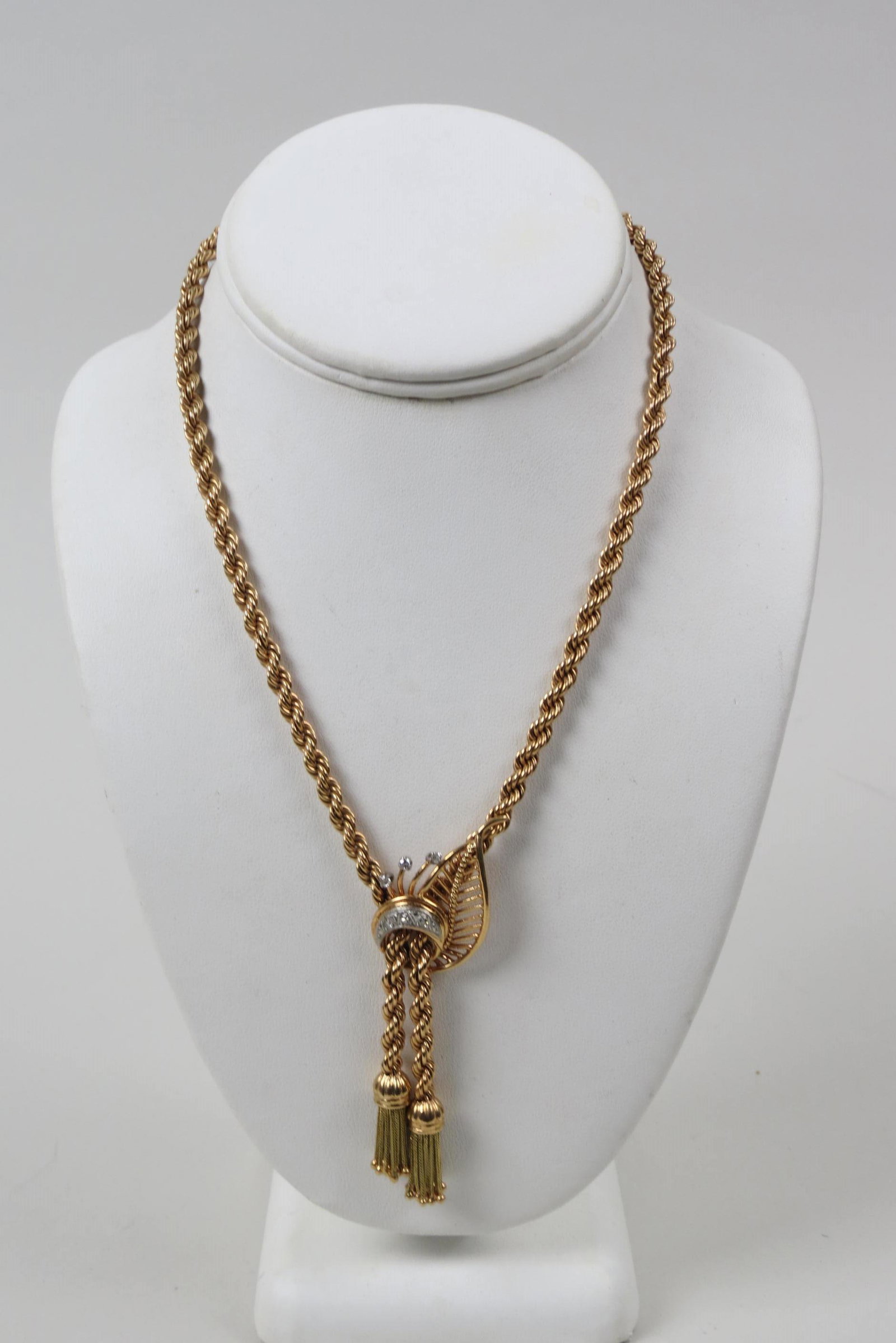 14K Gold & Diamond Necklace,: Retro design with tassels, 6 round diamonds totaling .20 carat, 14K yellow gold, 17 1/2" long, 45 grams.