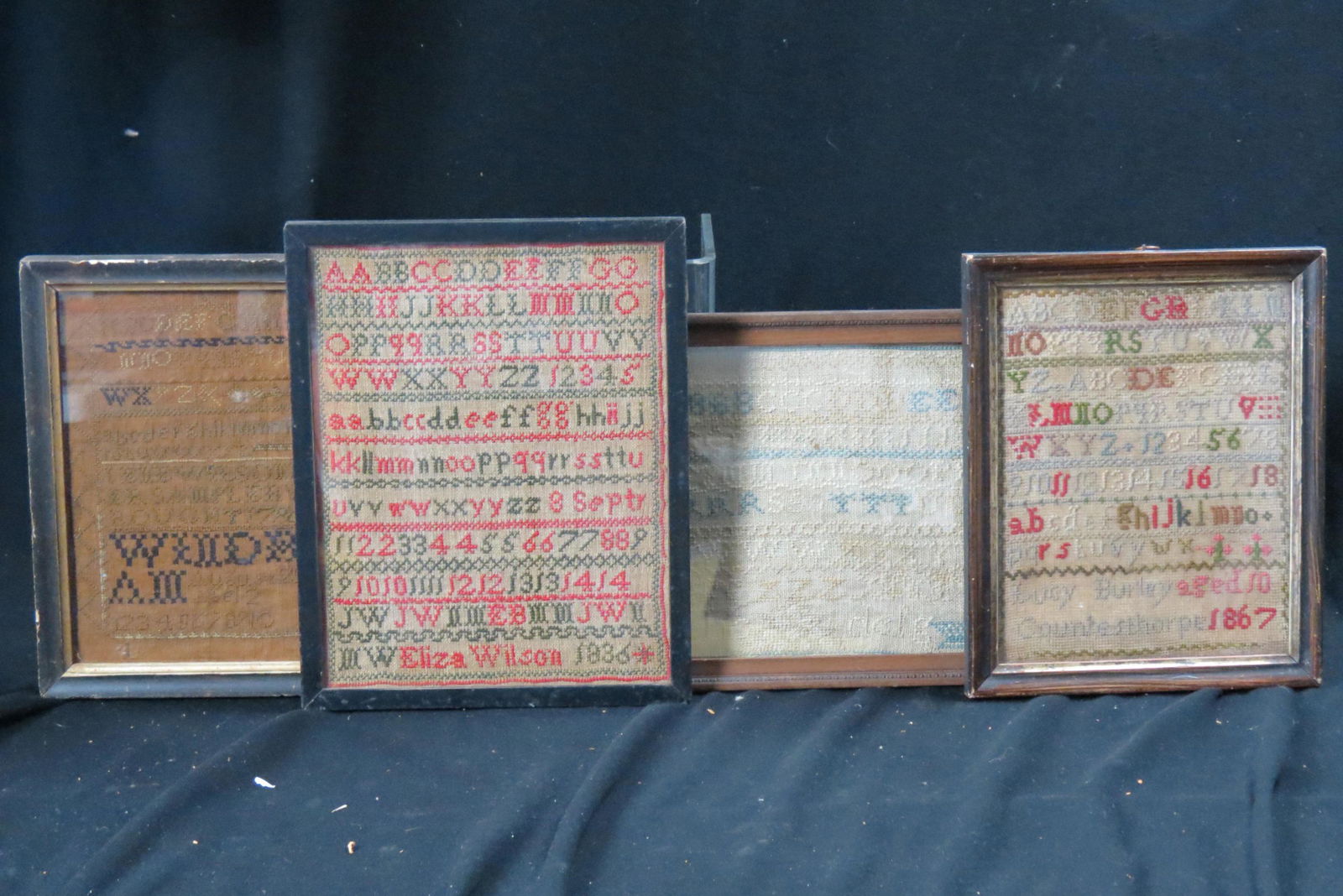 4 Early Samplers,: 1796 by Lene Wilsonmer (?), 1836 by Eliza Wilson, 1867 by Lucy Burley, in Countesthorpe at age 10 and other, largest is 8" X 11" plus frame.