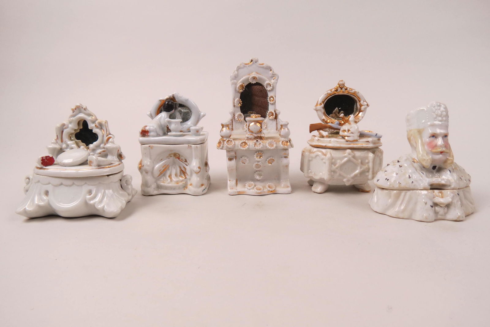 5 Staffordshire "Fairings" Figural Porcelain Boxes: including King, child on dresser and more, 19th century.....Fairings were a popular fair souvenir during the middle of the Victorian era through 1915. Commemorative buildings and people, along with po