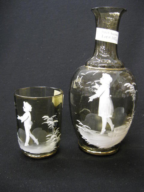 Mary Gregory Art Glass Bedside Pitcher & Tumbler,: white enamel on topaz, 8", a scarcer set, circa 1890, excellent.Mary Gregory actually worked for the Boston and Sandwich glass factory from 1880 to 1884 decorating Gone with the Wind style lamps. - Th