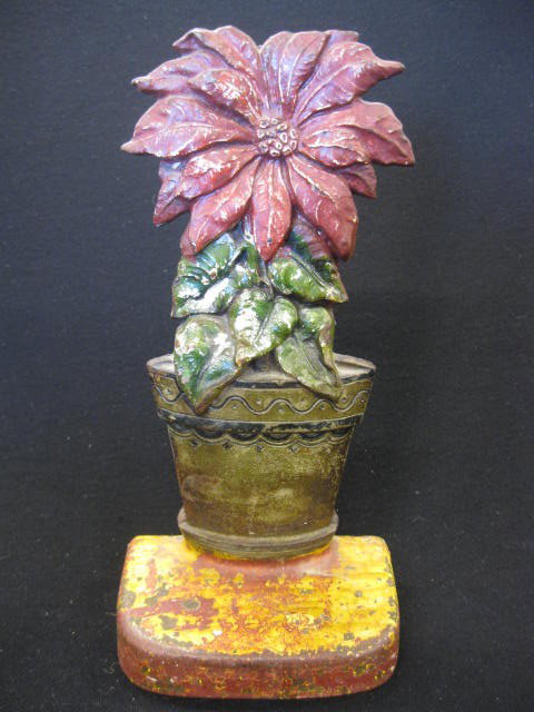 Poinsetta Cast Iron Figural Doorstop,: 10" tall.