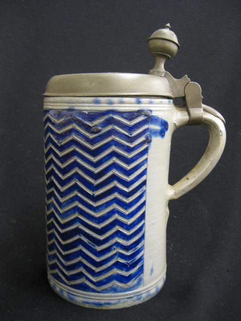 1773 Stoneware Stein, salt glaze, carved: zig-zag design with cobalt trim, 10-1/2", pewter lid with engraved cherub, saying and date of 1773