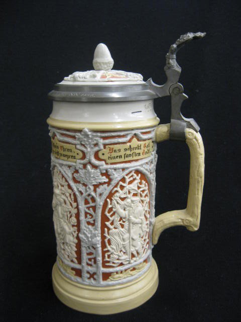 Mettlach Pottery Stein, bas-relief panels with: figures and sayings, inlaid top with acorn finial, 1/2 liter, 8-1/2" tall, lid has repair...Mettlach in their "golden age" of stein production between 1885 and 1910. Mettlach is easily the best known 