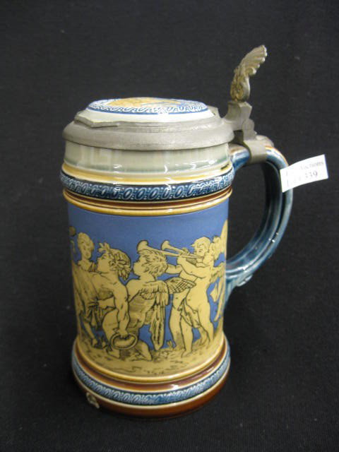 Mettlach Stein, etched Cherub band,: #2025, 3/10 liter, inlaid top, 6-1/2", small base chip..Mettlach in their "golden age" of stein production between 1885 and 1910. Mettlach is easily the best known name among manufacturers of old beer