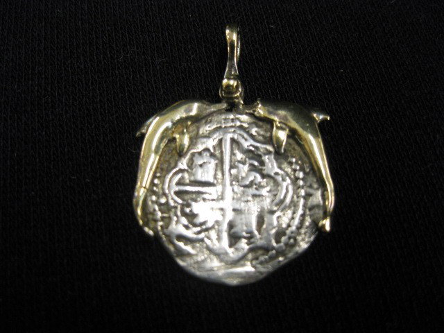 Atocha Spanish Treasure Coin Pendant,: dolphins around this copy by Mel Fisher of Treasure Salvors, Inc., made with silver from the Atocha wreck discovery in 1986, 1" diameter, with paper & pouche