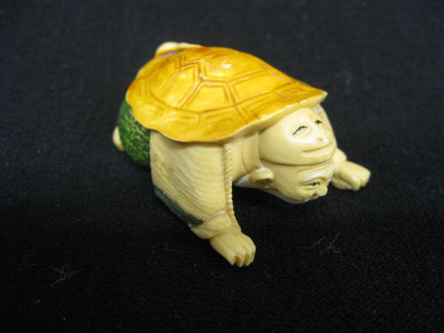 Chinese Carved Ivory Netsuke of Man wearing a tur: a turtle shell, fancy polychrome, 1-3/4", signed, excellent