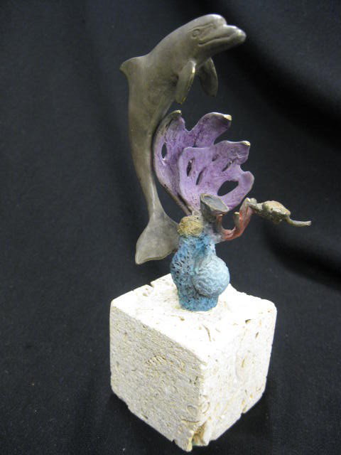 Stewart Wegner Bronze, dolphin with sea turtle &: dolphin with sea turtle & coral, limestone base, 6 1/2", excellent...... Born in 1954, Stewart and Steven, twins and the fourth and fifth sons of a naval officer, started out in Seattle, Washington bu