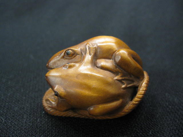 Carved Boxwood Netsuke of Two Frogs in a sandal, : a sandal, 1", excellent