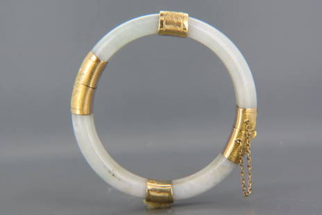 Chinese Jade & 14K Gold Bangle Bracelet,: gray-white, hinged, engraved leaf and floral designs on yellow gold, 11 mm, 52 grams, 7 1/4" interior measurement.