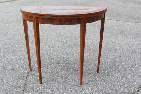 George III "Adams" style Demilune Card Table,: with center medallion of cherubs and oval medallions of maidens, 29" tall, 36" diameter open.