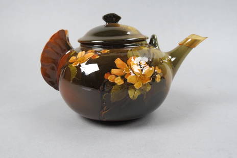Rookwood Pottery Teapot, 1891, Butterfly finial: and handle, floral, standard glaze, artist initials, 5" tall, 8" across, repaired.