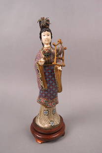 Chinese Cloisonne Figurine of Guanyin,: holding a bird on perch, carved face and hands, 13" tall plus silver wire inlaid base (14 1/2" overall),tip of the little pinky finger loss