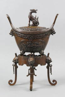 Japanese Bronze Censer, Meiji period, 2 pc.,: creature on top, foo dog handles and feet, footed stand with creature and ring handles, overall 14" tall.