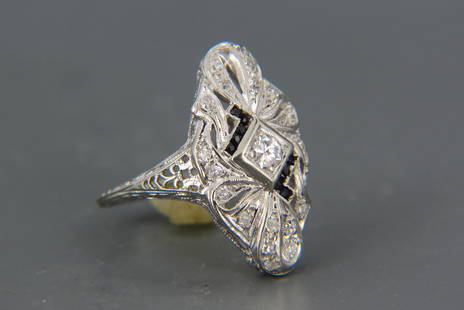 Diamond 18K Gold Art Deco Filigree Ring,: 20 round diamonds totaling over .65 carat with tiny square cut black onyx to highlight (two have chips), in finely engraved and openwork filigree setting, 4.7 grams, currently size 6 1/2.