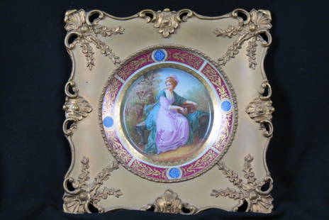 19th Century Framed Plate, woman in the garden,: seated with music box and bird cage, Royal Vienna style with fine gold work, 9 1/2" diameter plus fancy gold frame, overall 15" X 15".