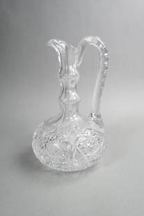 Cut Glass Pitcher,: bulbous base, ring neck, starburst, diamond and ray designs, 10 1/4", brilliant period.