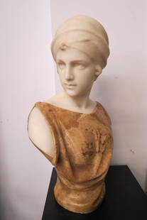 Guglielmo Pugi, Carved Marble Bust of Young Female: in browns and white, signed, well listed artist, 1850-1915, 28" tall......Biography from SetdartPugi developed his career in Florence between 1870 and 1915, the year of his death. He became famous