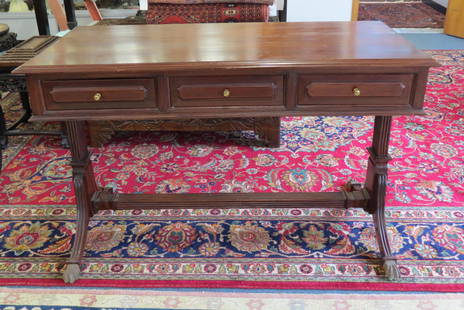 Mahogany Writing Desk,: 3 drawers, carved column designs on sides and stratcher, 24"X 48", 29" tall.