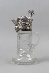 English Silverplate & Cut Glass Claret Jug,: scenes of cherubs at play and standing lion with shield above diamond and band design base, 11 1/2" tall, excellent.