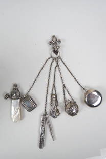 Victorian Chatelaine with Attachments,: includes perfume bottle, nickel holder, compact, rattle with whistle, pencils and locket, mostly German silver, some sterling, circa 1890...............This is a chatelaine. It was made up of