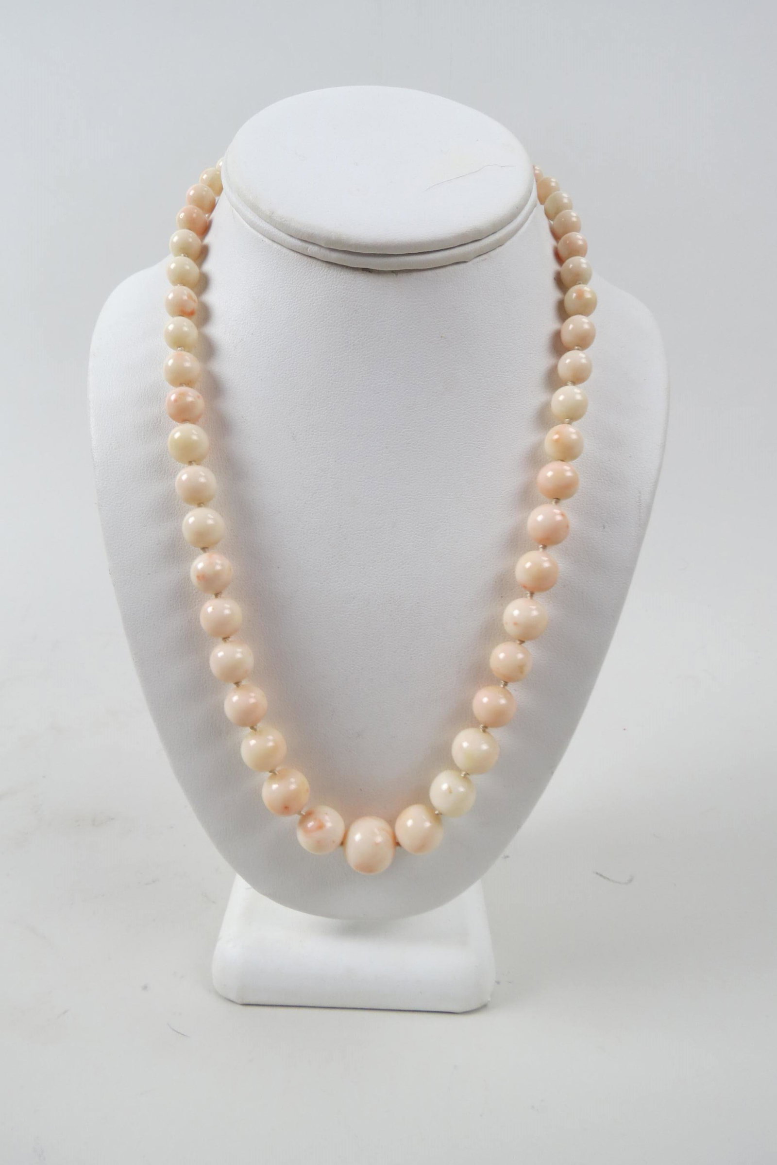 Angel Skin Coral Bead Necklace,: 50 graduated size beads, 7 to 15 mm, 14K gold clasp, 61 grams, 21" long.