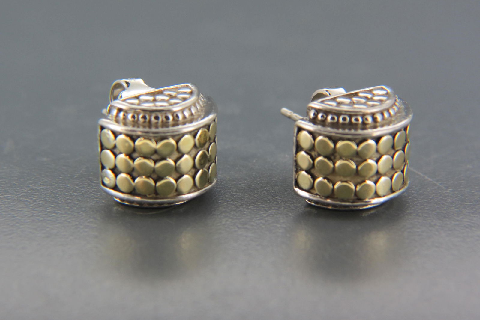 John Hardy 18K Gold & Sterling Earrings,: circular designs on half round, pierced, 10 grams, signed.