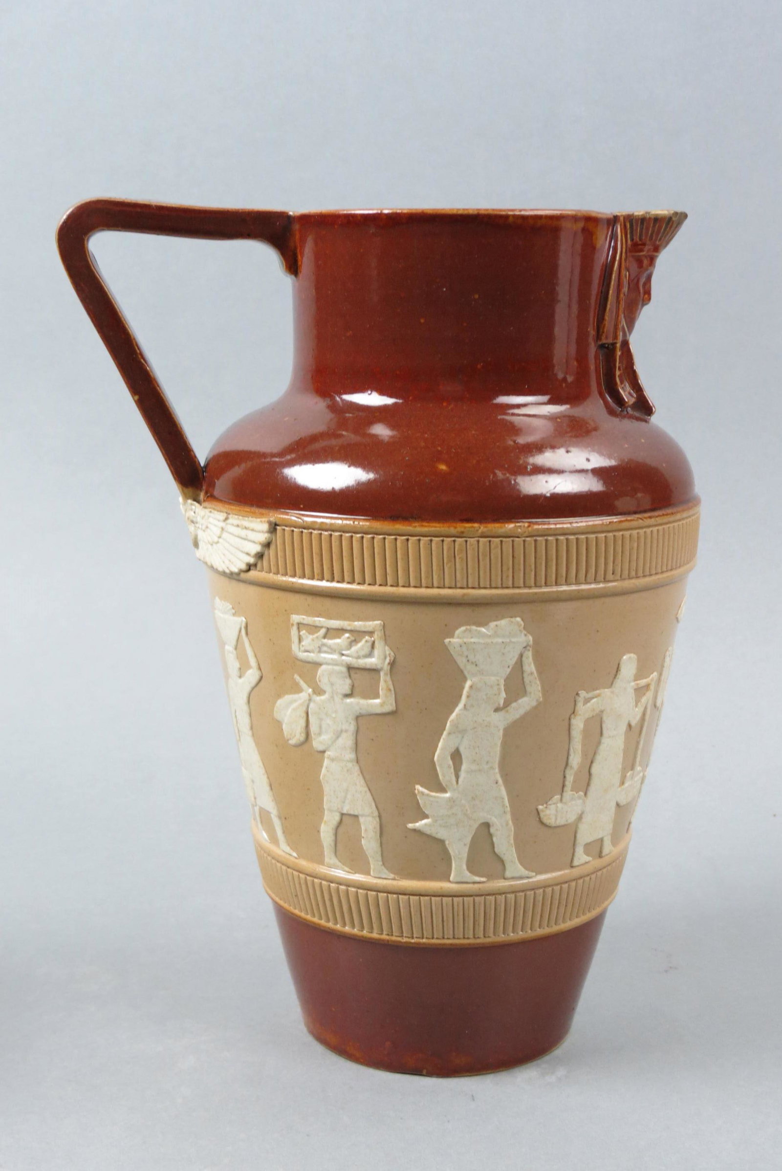 Doulton Lambeth Pottery Pitcher,: Egyptian workers in raised design, 9 1/2", circa 1900, small base chip and firing line.