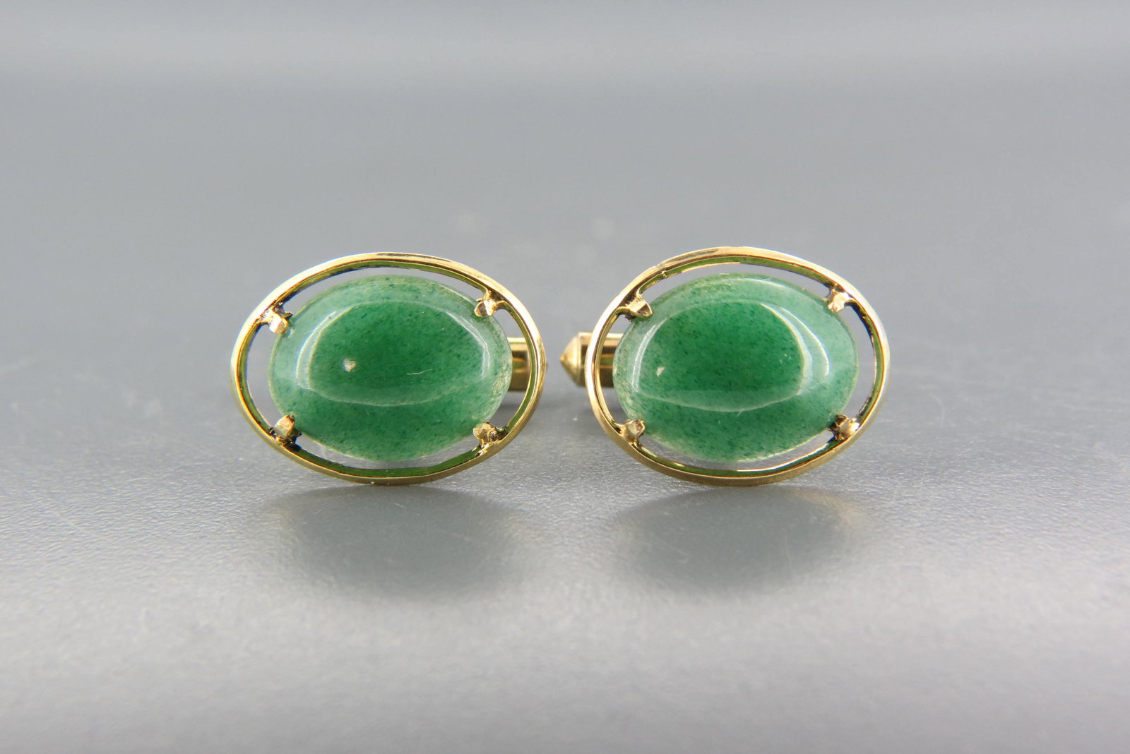 Adventurine & 14K Gold Cuff Links,: oval cabochons in yellow gold, 7.5 grams.