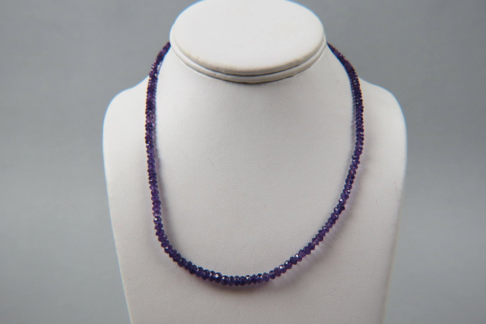 Amethyst & 14K Gold Necklace,: rich faceted gem beads with 14K yellow gold clasp, 18" long.