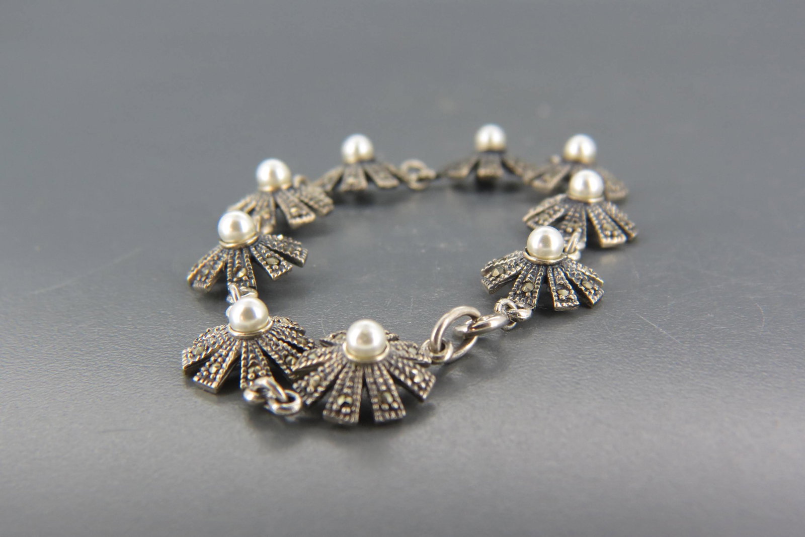 Sterling Silver, Pearl and Marcasite Bracelet,: flower style design, 12 grams, 7" long.