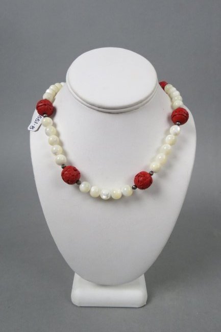 Chinese Carved Cinnabar & MOP Bead Necklace,: with 7 cinnabar beads measuring 16 mm each and 62 mother-of-pearl beads measuring 9.5 mm each, 30" long.