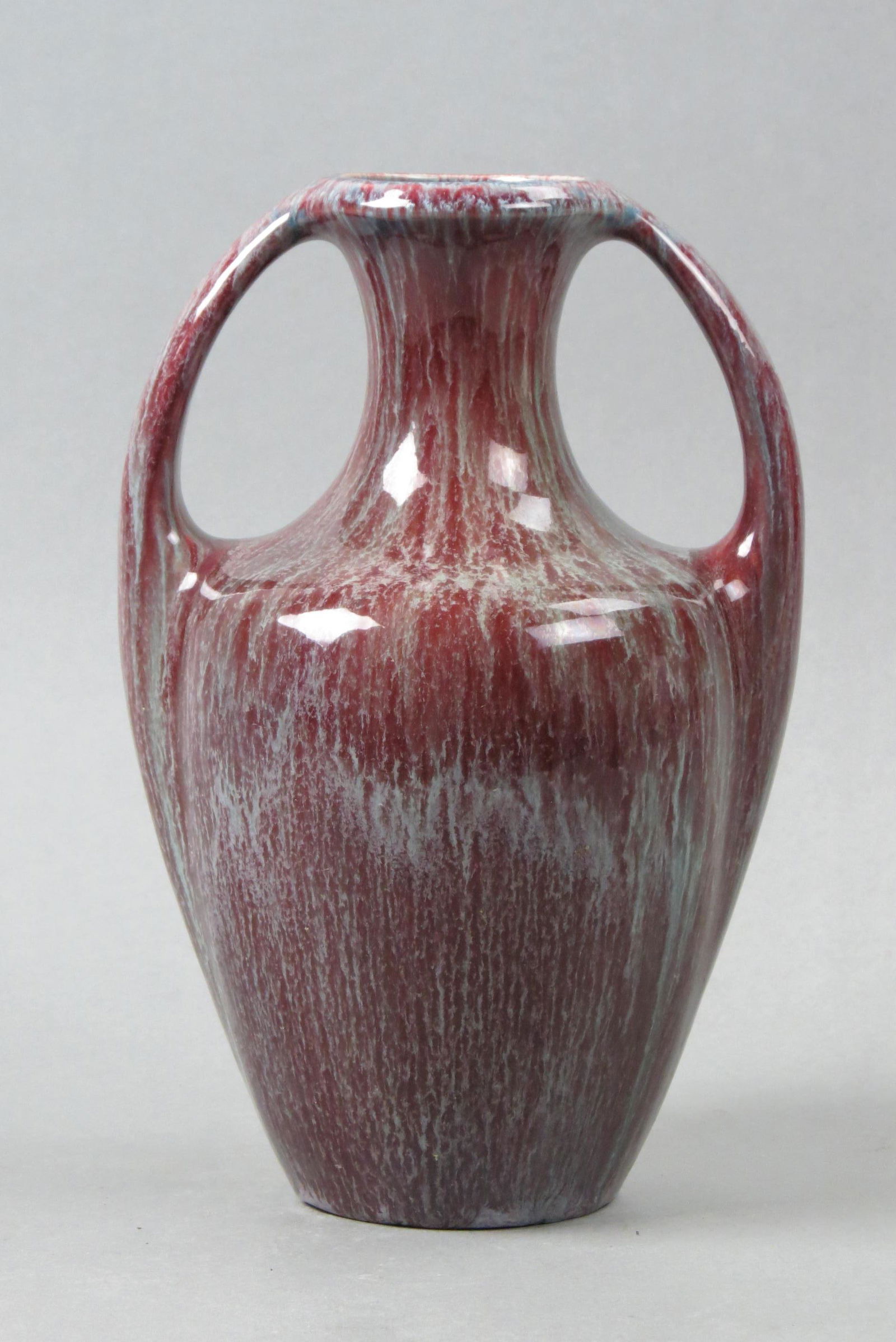 Bretby English Pottery Vase,: burgundy & blue-gray slip glaze, handled, 10", signed, excellent.....Bretby Art Pottery / Tooth & Co. - DescriptionIn 1879, Christopher Dresser, a designer, and John Harrison lent his support and enco