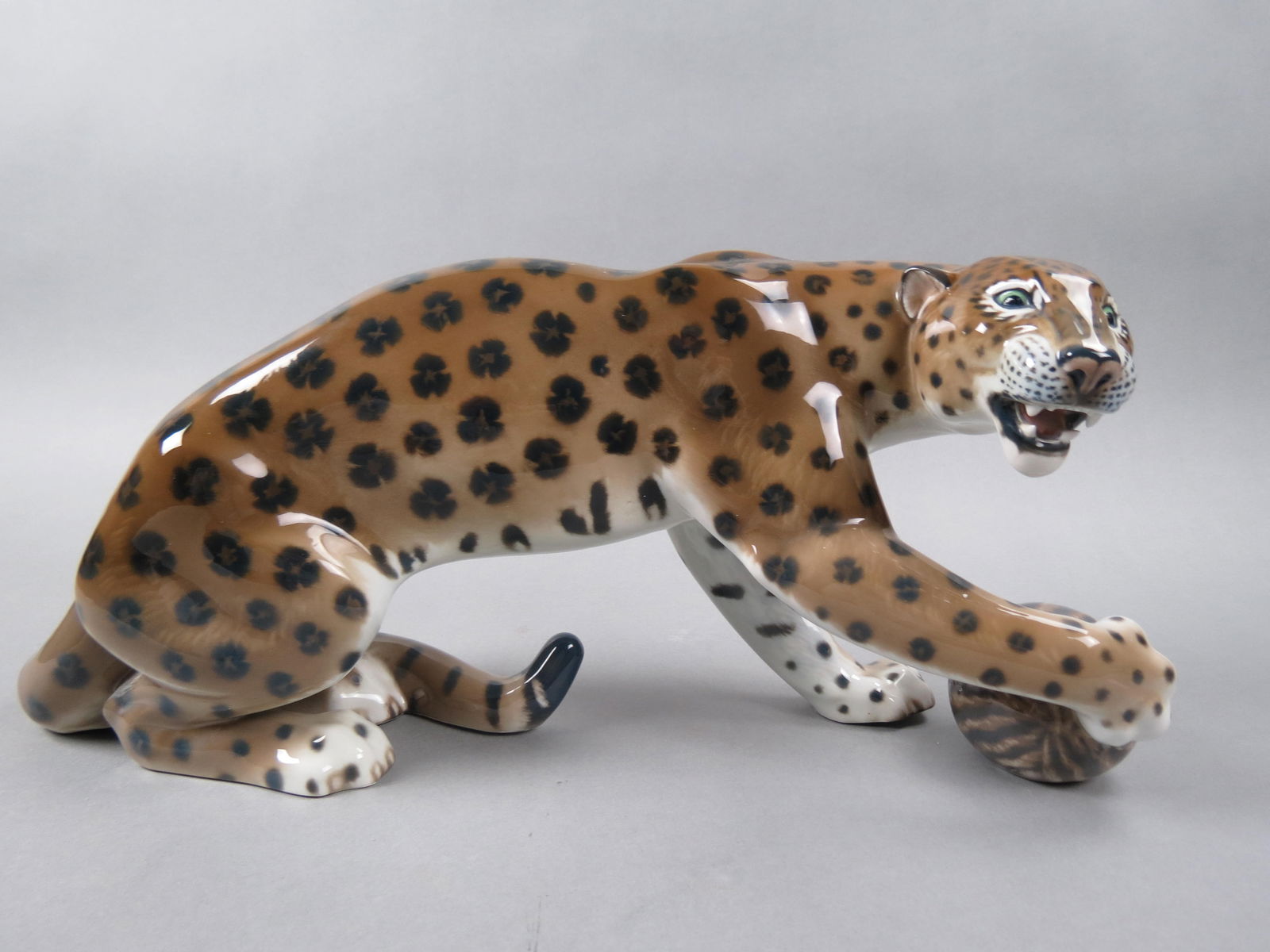 Rosenthal Porcelain Figurine "Leopard with Ball", scarce large size, 19" long, 8 1/2" tall, a: Rosenthal Porcelain Figurine "Leopard with Ball", scarce large size, 19" long, 8 1/2" tall, a stylized art deco designed leopard, designed by Gerhard Schliepstein in 1933, signed with the Rosenthal Ge