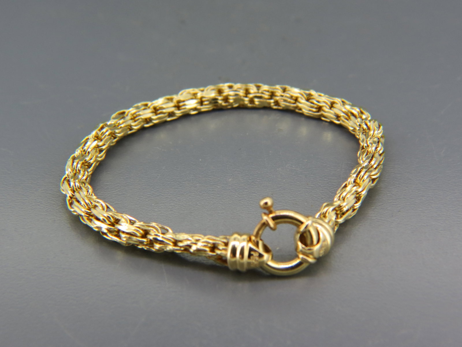 14K Gold Bracelet, braided style design, yellow gold, 7" long, 5 grams.: 14K Gold Bracelet, braided style design, yellow gold, 7" long, 5 grams.