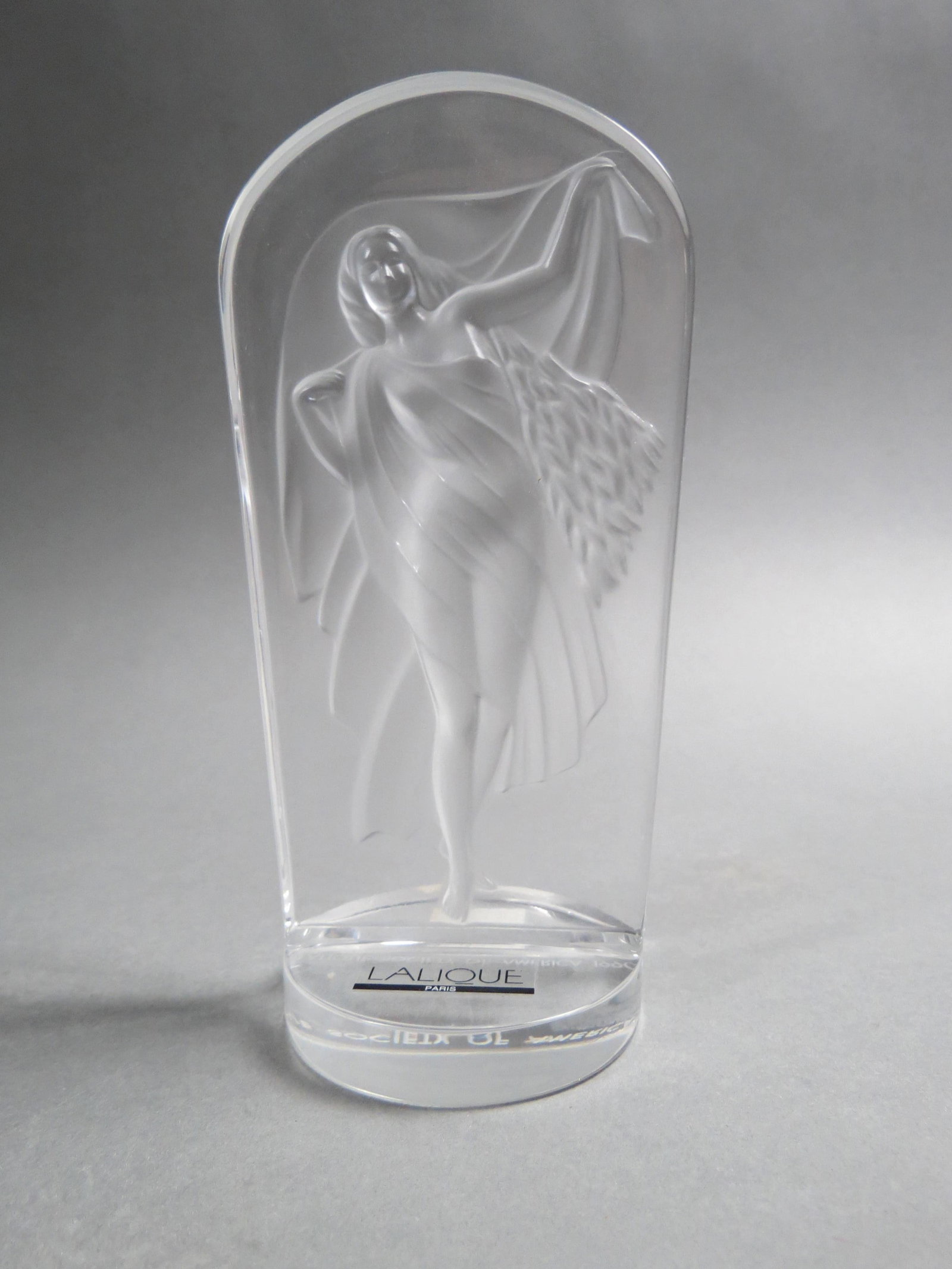 Lalique Crystal Figurine of a Female, in flowing gown, frosted profile on clear background, 5 3/4",: Lalique Crystal Figurine of a Female, in flowing gown, frosted profile on clear background, 5 3/4", signed, excellent.