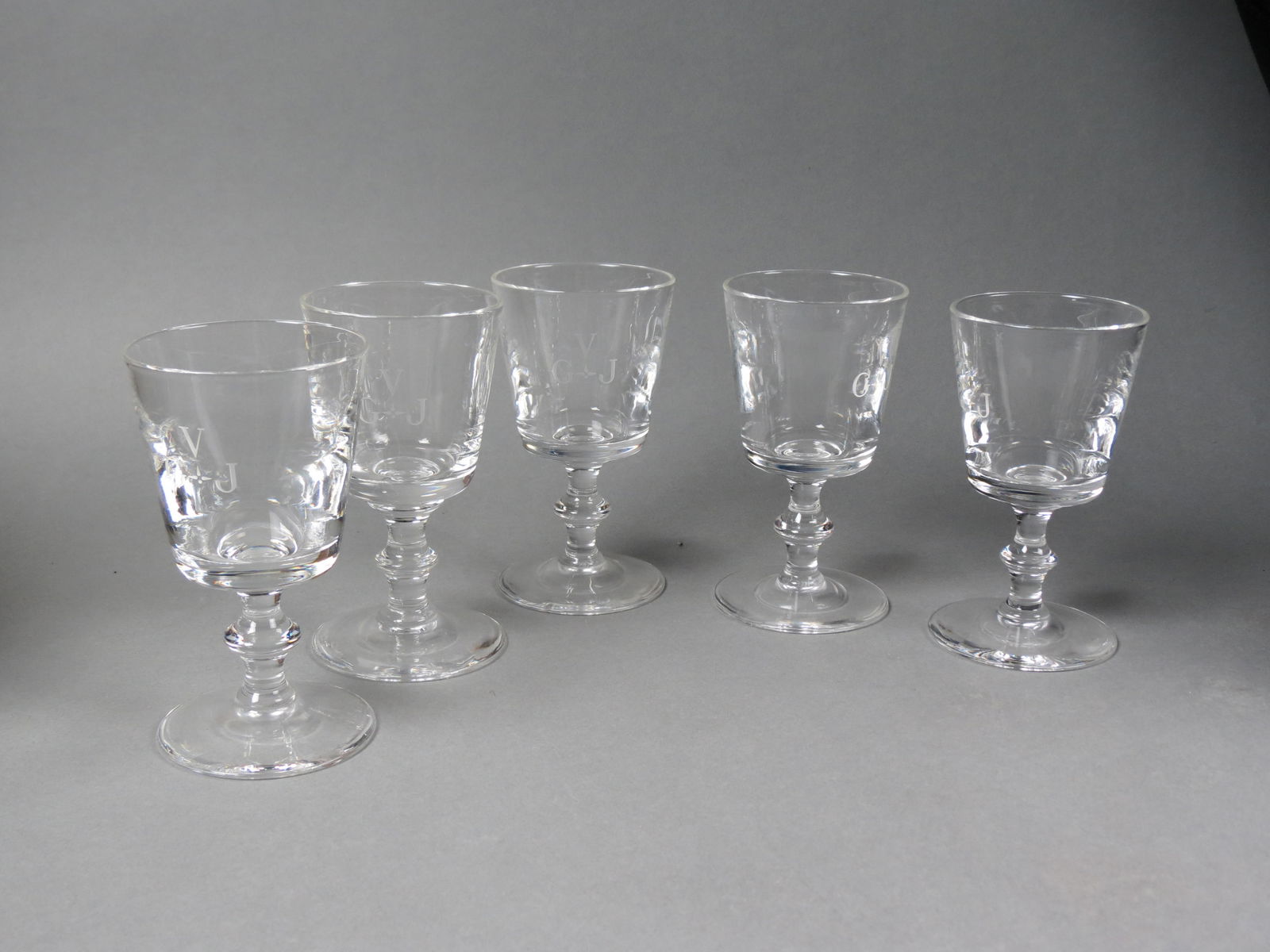 5 Steuben Crystal Wine Glasses, knob and pedestal bases, Art Deco style monogram, 5", signed,: 5 Steuben Crystal Wine Glasses, knob and pedestal bases, Art Deco style monogram, 5", signed, excellent.