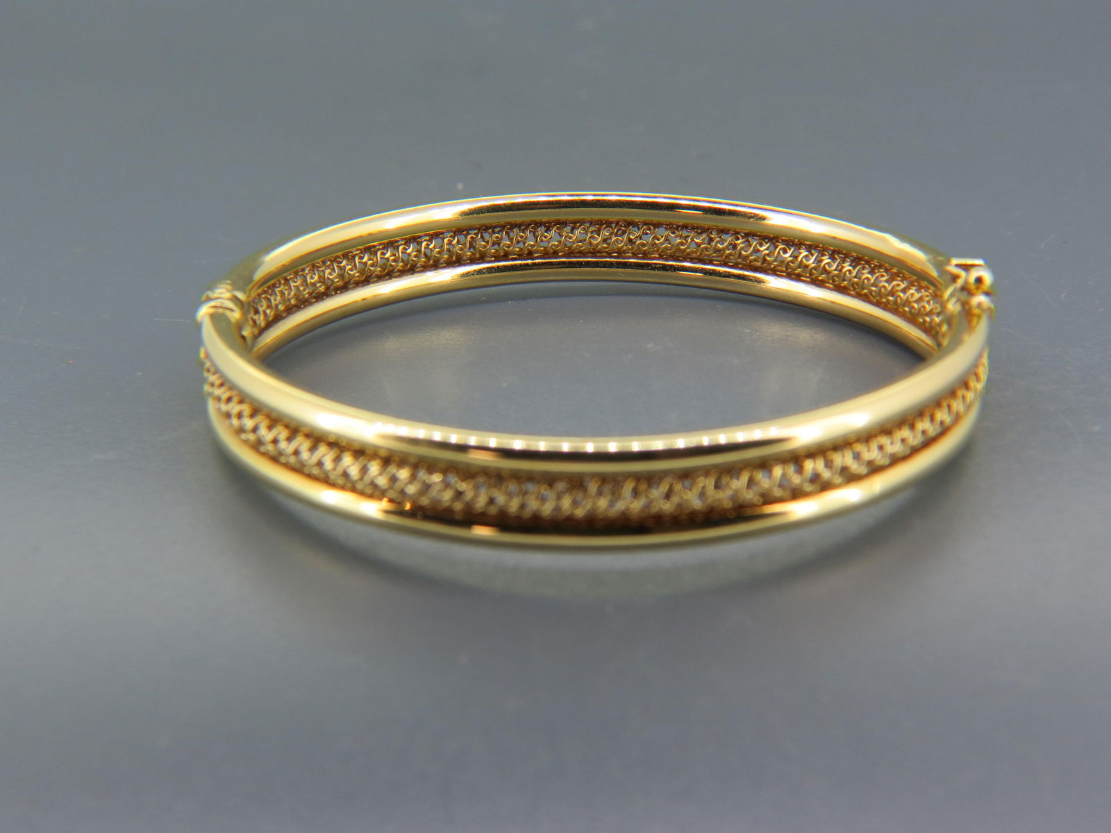 14K Gold Bangle Bracelet, Italian, openwork braided design center with  tubular sides, ovoid, (1 of 3)
